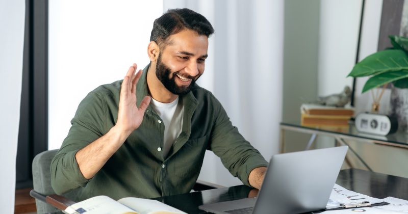 pleasant-friendly-indian-guy-manager-or-financial-consultant-communicates-with-colleagues-on-a